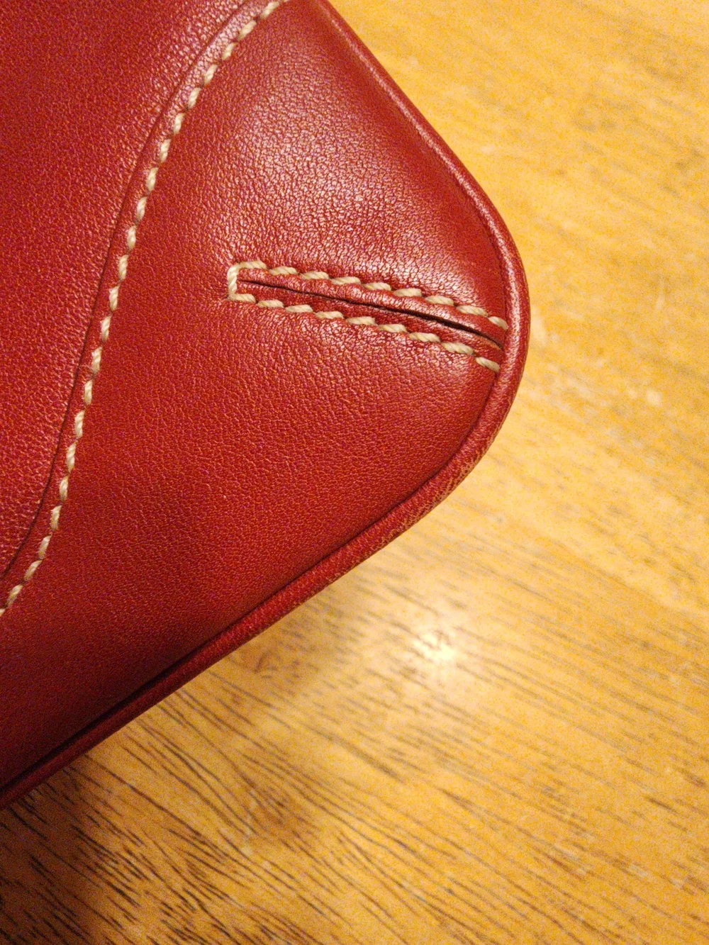 vintage Coach red leather Soho mini wristlet pouch featuring white contrast